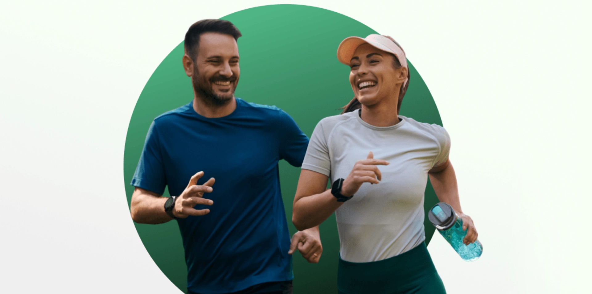 A man and woman jogging together, smiling and enjoying exercise.